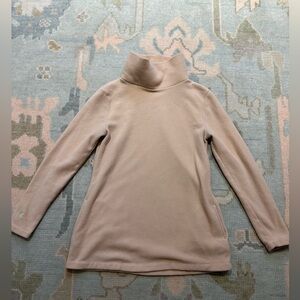 Dudley Stephen’s tan turtleneck in medium